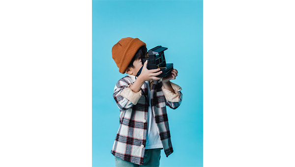 Boy holding a camera